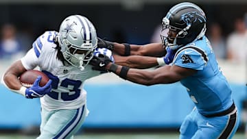 Oct 12, 2025; Charlotte, North Carolina, USA; Dallas Cowboys running back Jaydon Blue (23) runs with the ball during the second quarter against the Carolina Panthers at Bank of America Stadium.