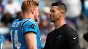 Oct 26, 2025; Charlotte, North Carolina, USA; Carolina Panthers quarterback Andy Dalton (14) with head coach Dave Canales before a game at Bank of America Stadium. 
