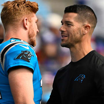 Oct 26, 2025; Charlotte, North Carolina, USA; Carolina Panthers quarterback Andy Dalton (14) with head coach Dave Canales before a game at Bank of America Stadium. 