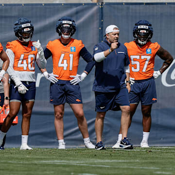 Jul 24, 2025; Englewood, CO, USA; Denver Broncos inside linebackers coach Jeff Schmedding with linebackers Levelle Bailey (56), Justin Strnad (40), Drew Sanders (41), Dre Greenlaw (57), and Alex Singleton (49) during Denver Broncos Training Camp