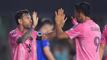 Inter Miami CF forward Luis Suarez (9) celebrates with forward Lionel Messi (10) after scoring against CF Montreal during the second half at Chase Stadium.