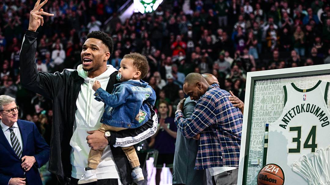 Apr 7, 2023; Milwaukee, Wisconsin, USA; Milwaukee Bucks forward Giannis Antetokounmpo (34) waves to fans while holding his child, Shia, during ceremony recognizing his accomplishments during 10 years with the team before game against the Memphis Grizzlies at Fiserv Forum. Mandatory Credit: Benny Sieu-USA TODAY Sports Apr 7, 2023; Milwaukee, Wisconsin, USA; Milwaukee Bucks forward Giannis Antetokounmpo (34) waves to fans while holding his child, Shia, during ceremony recognizing his accomplishments during 10 years with the team before game against the Memphis Grizzlies at Fiserv Forum. Mandatory Credit: Benny Sieu-USA TODAY Sports