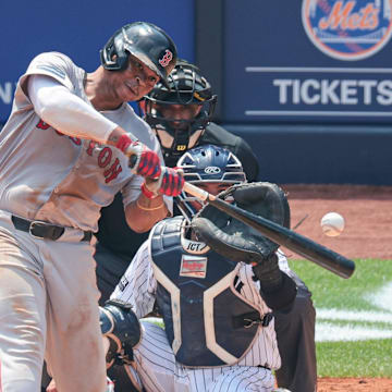 Jul 6, 2024; Bronx, New York, USA; Boston Red Sox third baseman Rafael Devers (11) hits a solo home run during the fifth inning against the New York Yankees at Yankee Stadium.
