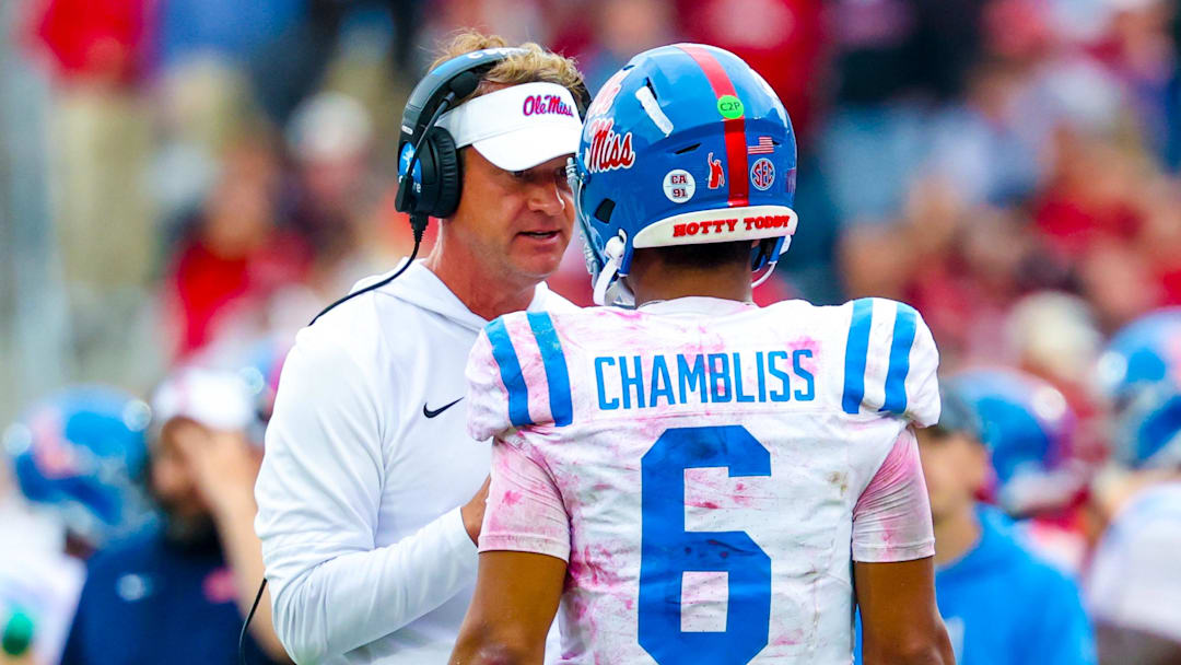 Oct 25, 2025; Norman, Oklahoma, USA;  Ole Miss Rebels head coach Lane Kiffin speaks with Ole Miss Rebels quarterback Trinidad Chambliss (6) during the second half at Gaylord Family-Oklahoma Memorial Stadium. Mandatory Credit: Kevin Jairaj-Imagn Images