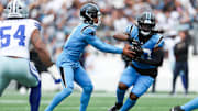Oct 12, 2025; Charlotte, North Carolina, USA; Carolina Panthers quarterback Bryce Young (9) hands the ball to running back DeeJay Dallas (20) during the first quarter against the Dallas Cowboys at Bank of America Stadium.