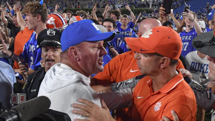 Sep 4, 2023; Durham, North Carolina, USA; Clemson Tigers head coach Dabo Swinney talks with Duke Blue Devils head coach Mike Elko while fans storm the field after the game at Wallace Wade Stadium in Durham, N.C. Mandatory Credit: Ken Ruinard-USA TODAY Sports