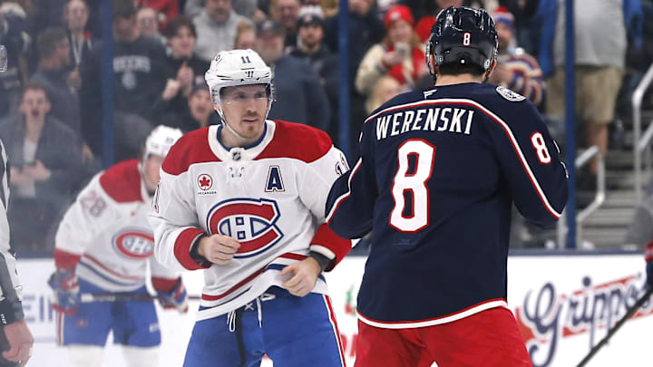 Nov 27, 2024; Columbus, Ohio, USA; Columbus Blue Jackets defenseman Zach Werenski (8) and Montreal Canadiens right wing Brendan Gallagher (11) fight during the second period at Nationwide Arena. Mandatory Credit: Russell LaBounty-Imagn Images