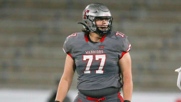 Thompson offensive lineman Stanton Ramil (77) waits for a play to begin during the 7A state championship game in Birmingham Wednesday, Dec. 1, 2021. [Staff Photo/Gary Cosby Jr]

7a Championship Central Vs Thompson