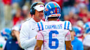 Oct 25, 2025; Norman, Oklahoma, USA;  Ole Miss Rebels head coach Lane Kiffin speaks with Ole Miss Rebels quarterback Trinidad Chambliss (6) during the second half at Gaylord Family-Oklahoma Memorial Stadium. Mandatory Credit: Kevin Jairaj-Imagn Images