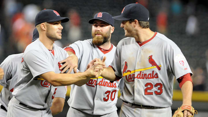 May. 7, 2012; Phoenix, AZ, USA; St. Louis Cardinals outfielder Skip Schumaker (55) , pitcher  Jason Motte (30) and infielder David Freese (23) celebrate after defeating the Arizona Diamondbacks at Chase Field. The Cardinals defeated the Diamondbacks 9-6. Mandatory Credit: Jennifer Stewart-Imagn Images