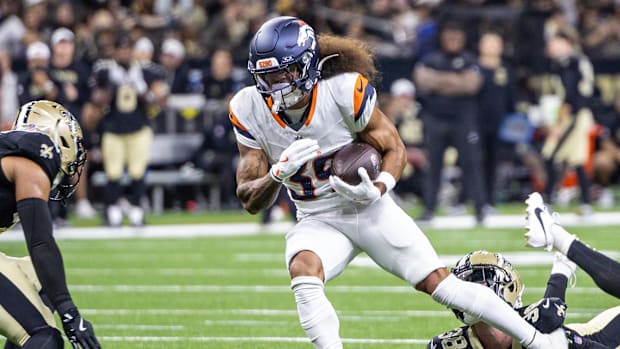 Denver Broncos wide receiver Kyrese Rowan (39) is tackled by New Orleans Saints safety Elliott Davison (35).