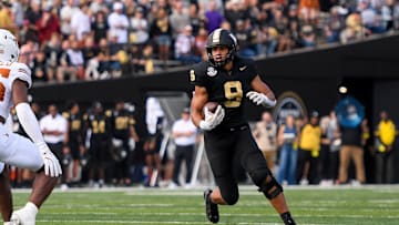 Oct 26, 2024; Nashville, Tennessee, USA;  Vanderbilt Commodores tight end Eli Stowers (9) runs the ball as Texas Longhorns defensive back Jelani McDonald (25) during the first half at FirstBank Stadium. Mandatory Credit: Steve Roberts-Imagn Images