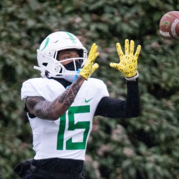 Oregon wide receiver Tez Johnson catches a pass during practice with the Oregon Ducks Thursday, April 4, 2024, at the Hatfield-Dowlin Complex in Eugene, Ore.