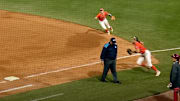 An umpire turned his back on the play in the NCAA softball championship.