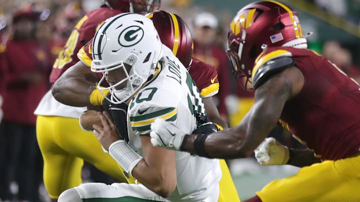 Washington Commanders safety Will Harris (3) tackles Green Bay Packers quarterback Jordan Love after a key conversion on Thursday. Washington Commanders safety Will Harris (3) tackles Green Bay Packers quarterback Jordan Love after a key conversion on Thursday.
