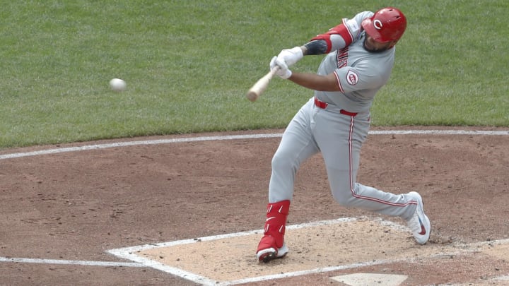 Aug 25, 2024; Pittsburgh, Pennsylvania, USA;  Cincinnati Reds first baseman Dominic Smith (0) hits a single against the Pittsburgh Pirates during the fourth inning at PNC Park. Mandatory Credit: Charles LeClaire-USA TODAY Sports