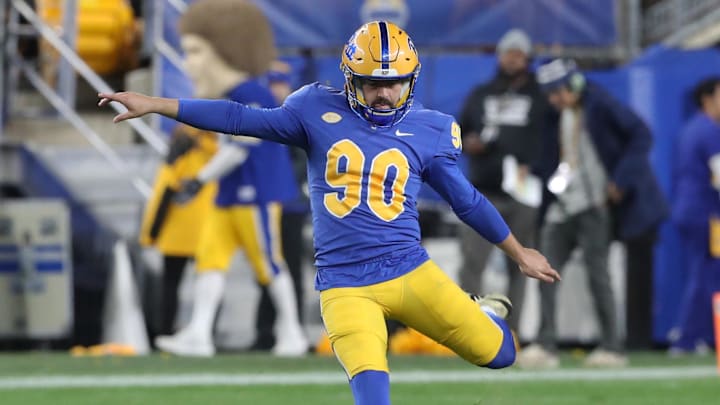 Nov 9, 2024; Pittsburgh, Pennsylvania, USA;  Pittsburgh Panthers place kicker Ben Sauls (90) kicks off to the Virginia Cavaliers during the second quarter at Acrisure Stadium. Mandatory Credit: Charles LeClaire-Imagn Images