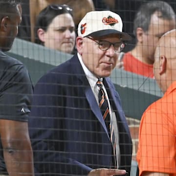 Jul 30, 2024; Baltimore, Maryland, USA;  Baltimore Orioles majority owner David Rubenstein speaks with Cal Ripken behind home plate during the game against the Toronto Blue Jays at Oriole Park at Camden Yards.