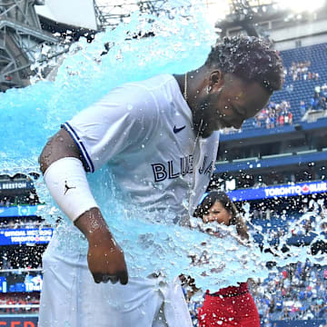 Toronto Blue Jays first baseman Vladimir Guerrero Jr. (right) is doused with ice water by third baseman Luis De Los Santos (not pictured) after defeating the St. Louis Cardinals at Rogers Centre on Sept 14.