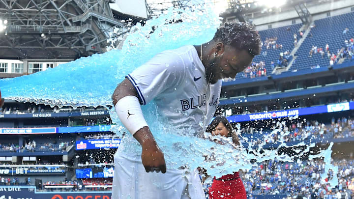 Toronto Blue Jays first baseman Vladimir Guerrero Jr. (right) is doused with ice water by third baseman Luis De Los Santos (not pictured) after defeating the St. Louis Cardinals at Rogers Centre on Sept 14.