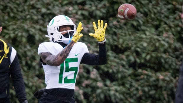 Oregon wide receiver Tez Johnson catches a pass during practice at the Hatfield-Dowlin Complex in Eugene, Ore.