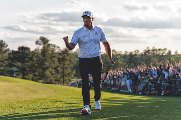 Bryson Dechambeau fist pumps after making a putt from just off the green on the 18th hole at the end of the third round.