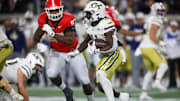 Nov 25, 2023; Atlanta, Georgia, USA; Georgia Tech Yellow Jackets running back Jamal Haynes (11) runs the ball against the Georgia Bulldogs in the second quarter at Bobby Dodd Stadium at Hyundai Field. Mandatory Credit: Brett Davis-Imagn Images