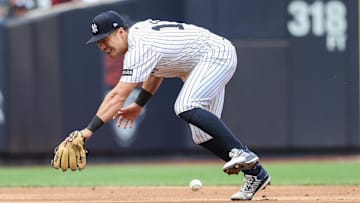 Apr 13, 2025; Bronx, New York, USA; New York Yankees shortstop Anthony Volpe (11) is unable to make a play on a ground ball in the sixth inning against the San Francisco Giants at Yankee Stadium. Mandatory Credit: Wendell Cruz-Imagn Images
