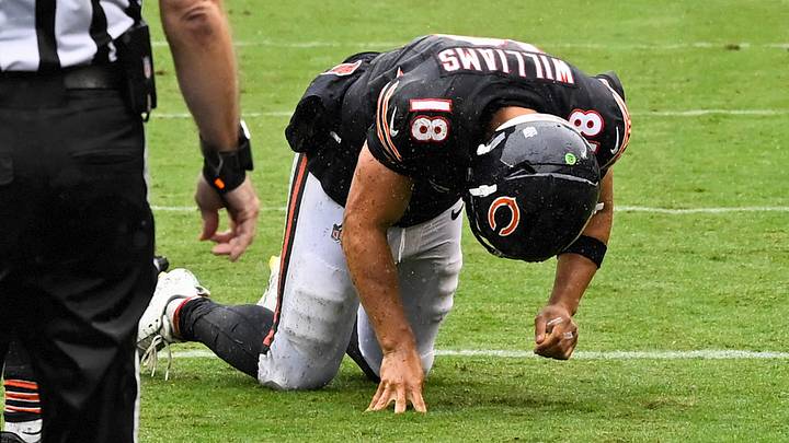 Sep 20, 2026; Chicago, Illinois, USA;  Chicago Bears quarterback Caleb Williams (18) kneels on the field with an apparent injury against the Minnesota Vikings during the second half at Soldier Field.  Mandatory Credit: Matt Marton-Imagn Images