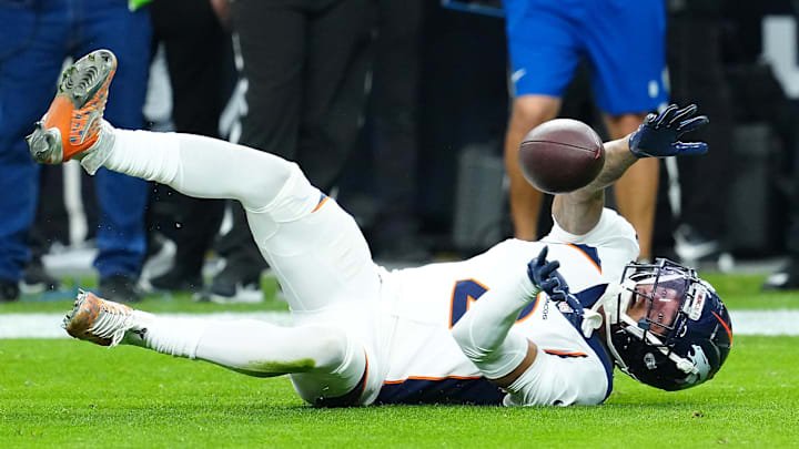 Jan 7, 2024; Paradise, Nevada, USA; Denver Broncos cornerback Pat Surtain II (2) misses an interception against the Raiders during the first quarter at Allegiant Stadium. Mandatory Credit: Stephen R. Sylvanie-USA TODAY Sports