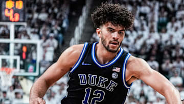 Michigan State guard Kur Teng (2) dribbles against Duke forward Cameron Boozer (12) during the second half at Breslin Center in East Lansing on Saturday, Dec. 6, 2025.