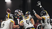 Sep 8, 2024; Atlanta, Georgia, USA; Atlanta Falcons quarterback Kirk Cousins (18) is hit by Pittsburgh Steelers defensive tackle Larry Ogunjobi (99) as he throws during the second half at Mercedes-Benz Stadium. Mandatory Credit: Dale Zanine-Imagn Images