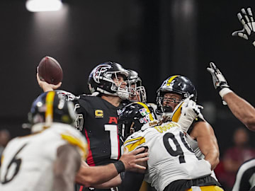 Sep 8, 2024; Atlanta, Georgia, USA; Atlanta Falcons quarterback Kirk Cousins (18) is hit by Pittsburgh Steelers defensive tackle Larry Ogunjobi (99) as he throws during the second half at Mercedes-Benz Stadium. Mandatory Credit: Dale Zanine-Imagn Images