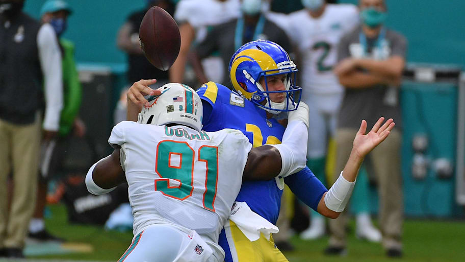 Miami Dolphins defensive end Emmanuel Ogbah (91) forces the fumble of Los Angeles Rams quarterback Jared Goff (16) during the first half at Hard Rock Stadium in a 2020 game. | Jasen Vinlove-Imagn Images