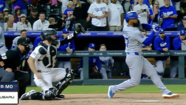 Teoscar Hernandez checks his swing on what should have been the final pitch of Dodgers - Rockies.