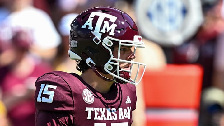 Oct 5, 2024; College Station, Texas, USA; Texas A&M Aggies quarterback Conner Weigman (15) looks on in the first half  against the Missouri Tigers at Kyle Field. Mandatory Credit: Maria Lysaker-Imagn Images. 