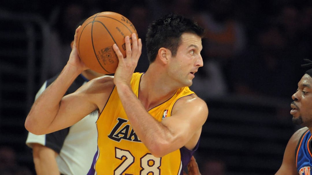 Dec 29, 2011; Los Angeles, CA, USA; Los Angeles Lakers forward Jason Kapono (28) is defended by New York Knicks forward Bill Walker (5) at the Staples Center. The Lakers defeated the Knicks 99-82. Mandatory Credit: Kirby Lee/Image of Sport-Imagn Images