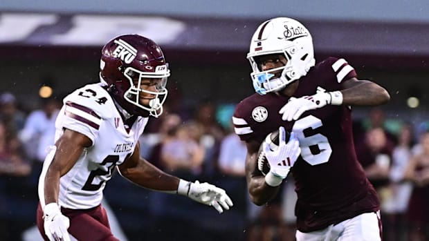 Mississippi State Bulldogs wide receiver Jordan Mosley runs the ball while defended by Eastern Kentucky Colonels.