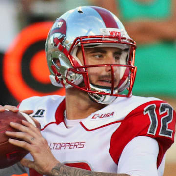 Oct 15, 2015; Denton, TX, USA; Western Kentucky Hilltoppers quarterback Brandon Doughty (12) in the pocket during a game against the North Texas Mean Green at Apogee Stadium. Western Kentucky won 55-28. Mandatory Credit: Ray Carlin-Imagn Images