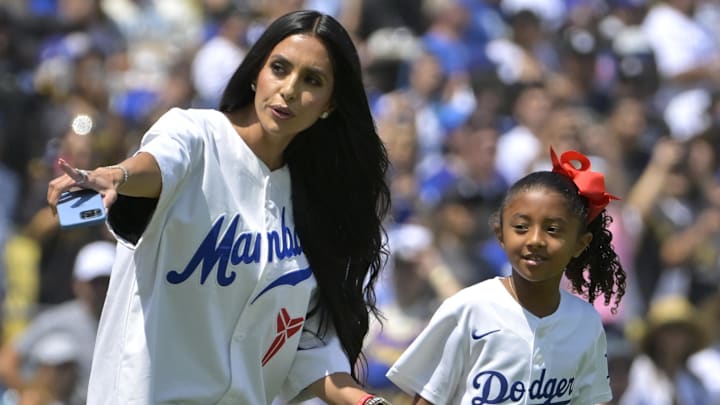 Vanessa Bryant, widow of Los Angeles Lakers Kobe Bryant, accompanies their daughter Bianka to the mound to throw out the first pitch against the Tampa Bay Rays.