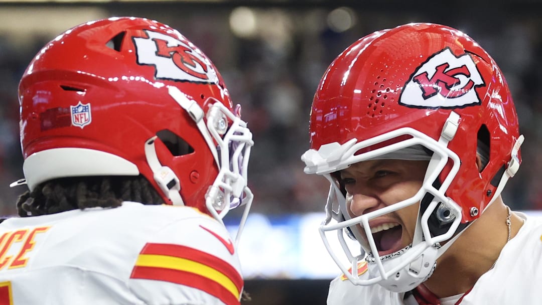 Nov 27, 2025; Arlington, Texas, USA; Kansas City Chiefs wide receiver Rashee Rice (4) and Kansas City Chiefs quarterback Patrick Mahomes (15) celebrate after a play against the Dallas Cowboys during the first quarter at AT&T Stadium. Mandatory Credit: Kevin Jairaj-Imagn Images