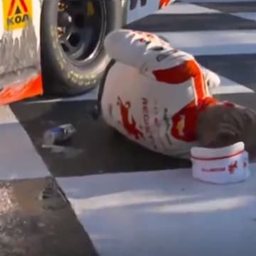 Driver Connor Zilisch falls after winning an Xfinity Series at Watkins Glen. 