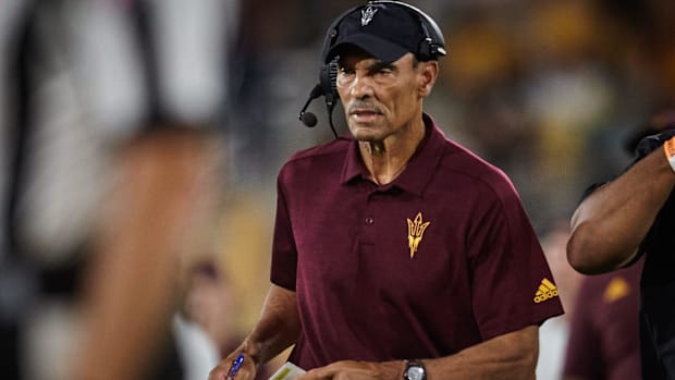 Arizona State Sun Devils head coach Herm Edwards walks the sidelines as his team plays the Eastern Michigan Eagles at Sun Dev