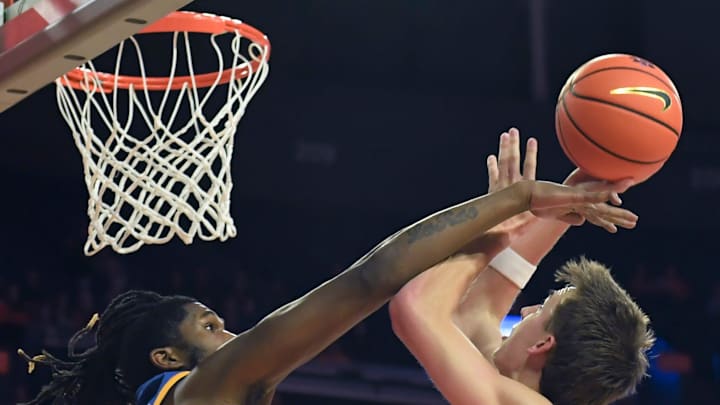 Morehead State Eagles center Tamaury Releford (24) defends the shot of Clemson Tigers forward Jake Wahlin (10) Tuesday, Nov. 11, 2025, during the NCAA men’s basketball game at Littlejohn Coliseum in Clemson, South Carolina.