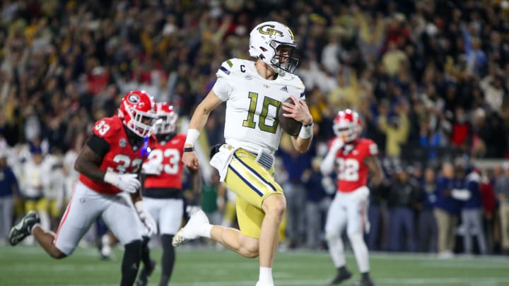 Nov 25, 2023; Atlanta, Georgia, USA; Georgia Tech Yellow Jackets quarterback Haynes King (10) runs for a touchdown against the Georgia Bulldogs in the first quarter at Bobby Dodd Stadium at Hyundai Field. Mandatory Credit: Brett Davis-USA TODAY Sports