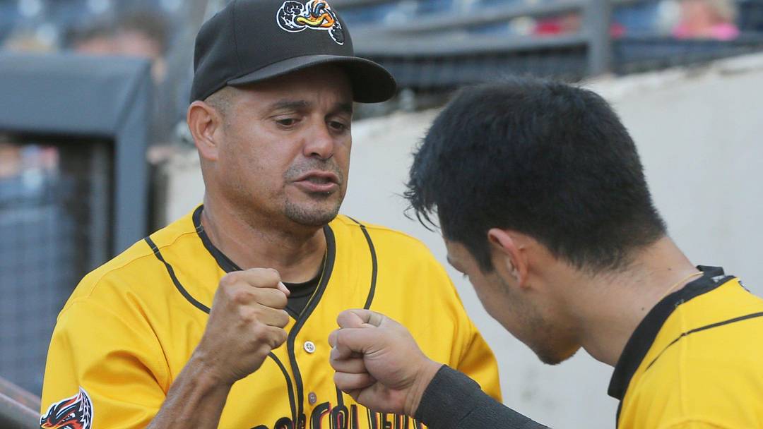 RubberDucks hitting coach Junior Betances fist bumps Steven Kwan before the start of the game against Harrisburg on Aug. 18, 2021, in Akron, Ohio. RubberDucks hitting coach Junior Betances fist bumps Steven Kwan before the start of the game against Harrisburg on Aug. 18, 2021, in Akron, Ohio.