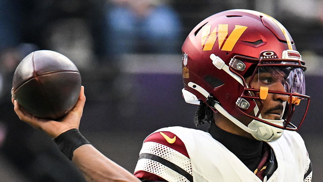 Washington Commanders quarterback Jayden Daniels drops back to pass against the Minnesota Vikings.
