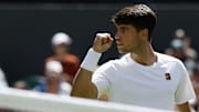 Carlos Alcaraz (ESP) reacts after winning a point against Fabio Fognini (ITA)(not pictured) on day one of The Championships, Wimbledon 2025 at All England Lawn Tennis and Croquet Club.
