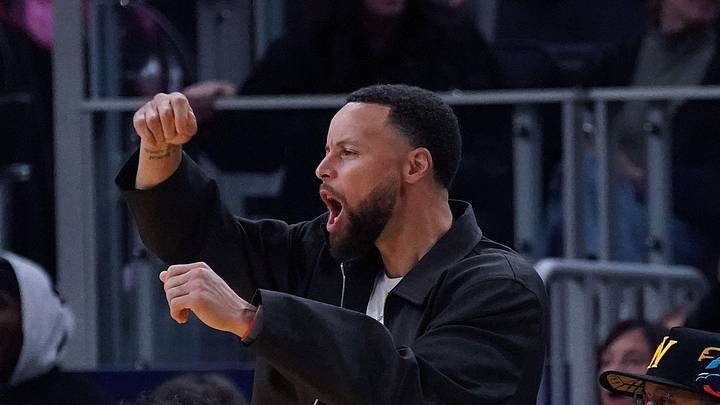 Feb 22, 2026; San Francisco, California, USA;  Golden State Warriors guard Stephen Curry (30) cheers from the bench in the third quarter during a game against the Denver Nuggets at Chase Center. Mandatory Credit: David Gonzales-Imagn Images