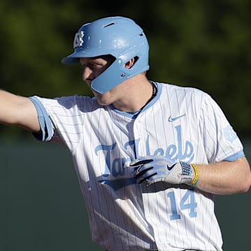North Carolina Tar Heels Parks Harber (14) reacts to hitting a double against the West Virginia Mountaineers in the third inning of the DI Baseball Super Regional at Boshamer Stadium. 